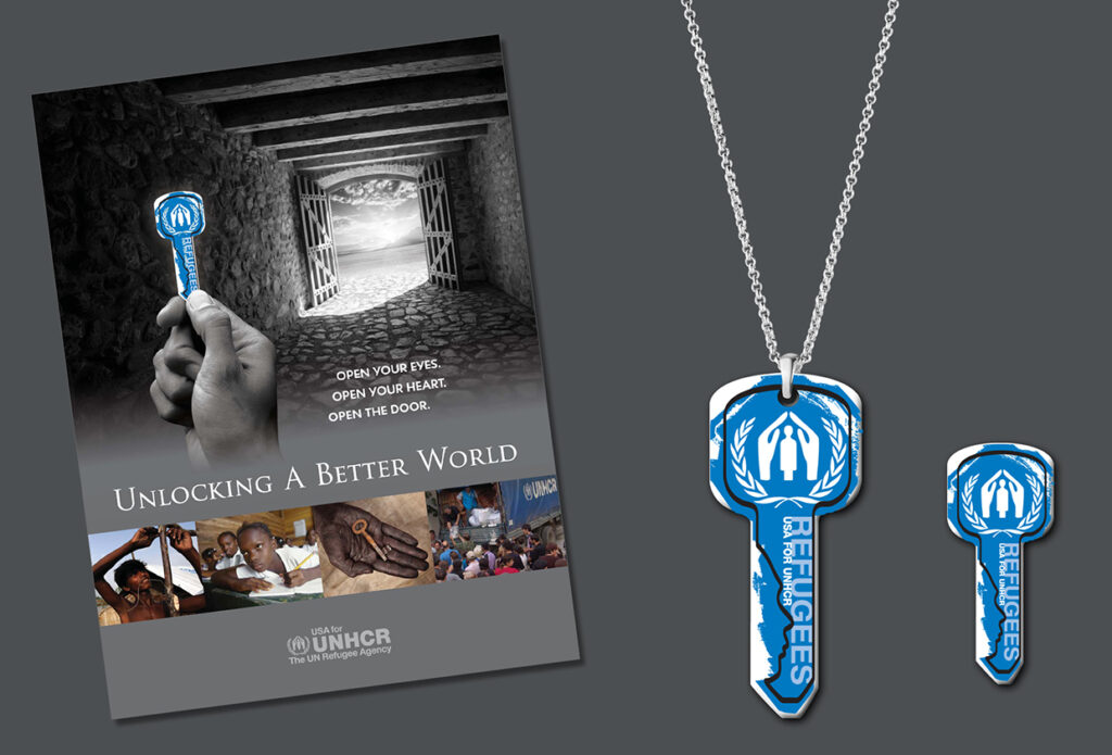 Collage with a brochure cover design and 2 pendants in the shape of keys